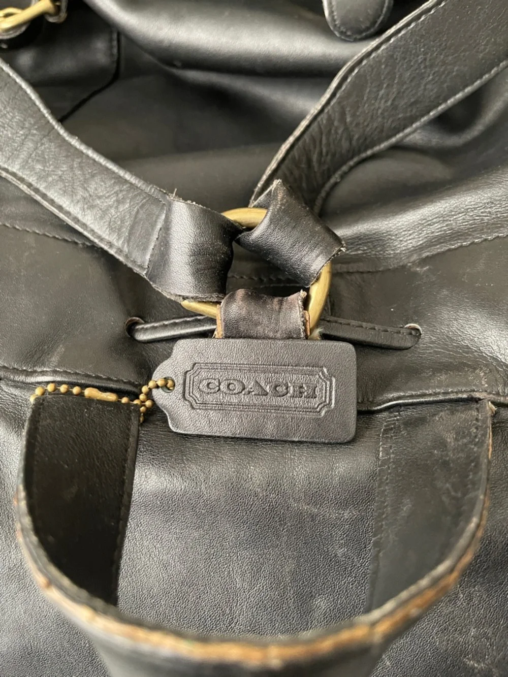 Coach Black Leather Drawstring Backpack with Front Zip Pocket